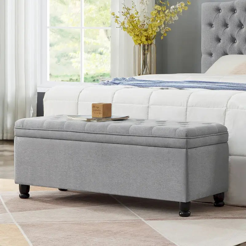Banc de rangement capitonné en tissu de lin avec pieds fuselés en bois