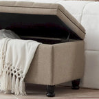 Banc de rangement capitonné en tissu de lin avec pieds fuselés en bois