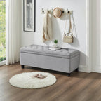 Banc de rangement capitonné en tissu de lin avec pieds fuselés en bois