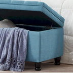 Banc de rangement capitonné en tissu de lin avec pieds fuselés en bois